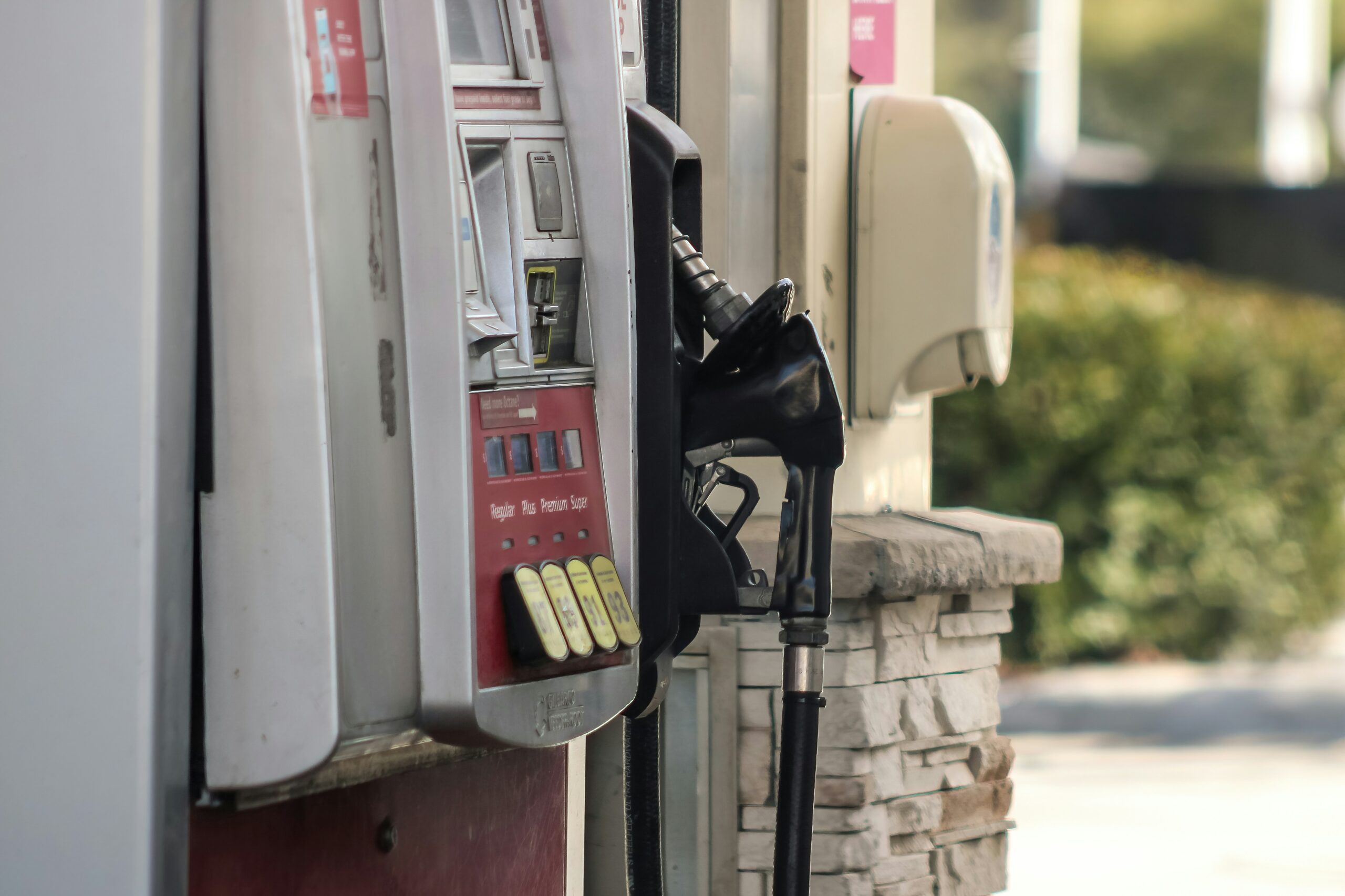 a pay phone on a sidewalk